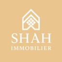 Logo Shah Immobilier — maison stylisée sur fond or